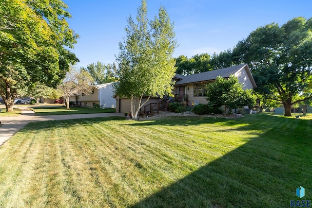 view of yard featuring a garage