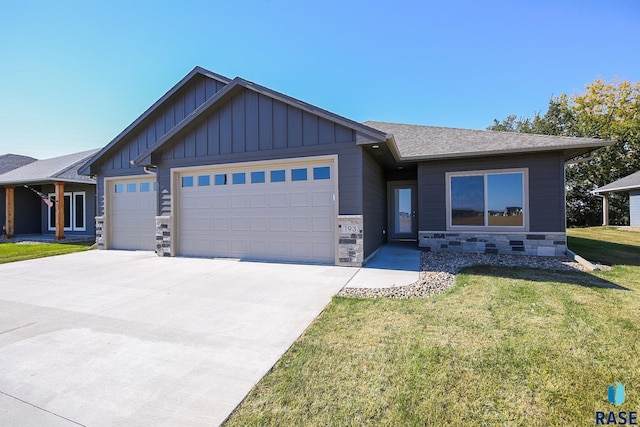 view of front of property with a garage and a front yard