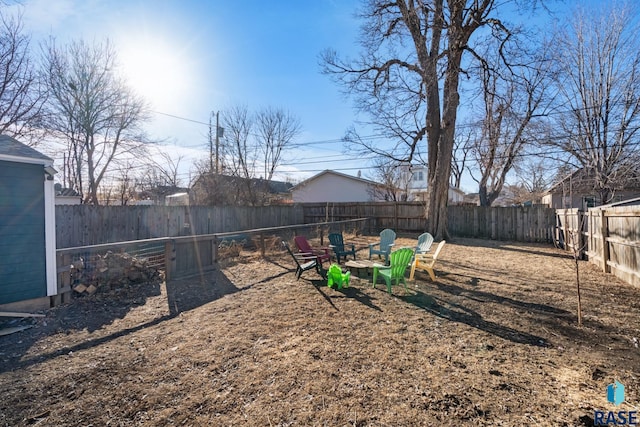 view of yard with a fire pit