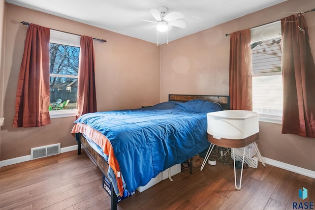 bedroom with hardwood / wood-style flooring and ceiling fan