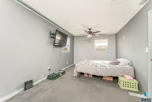 bedroom featuring ornamental molding, carpet, and ceiling fan