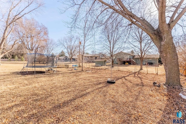 view of yard with a trampoline