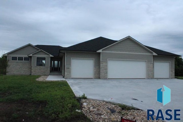 single story home featuring a garage