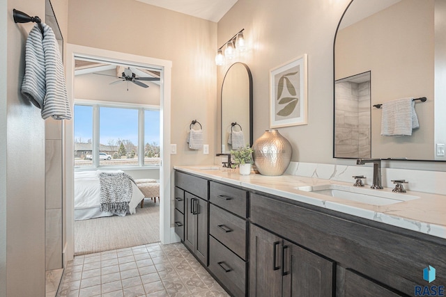 bathroom featuring vanity, vaulted ceiling, tile patterned floors, and ceiling fan