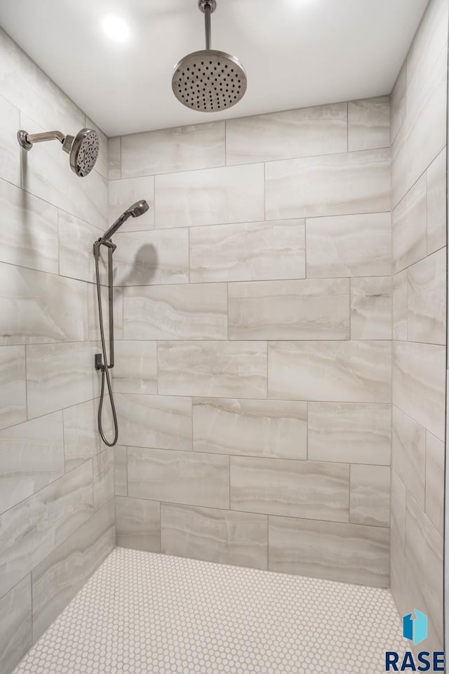 bathroom with tiled shower