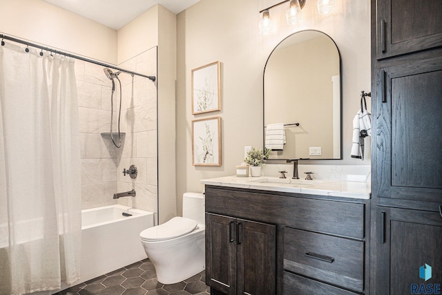 full bathroom featuring tile patterned floors, vanity, toilet, and shower / bath combo with shower curtain