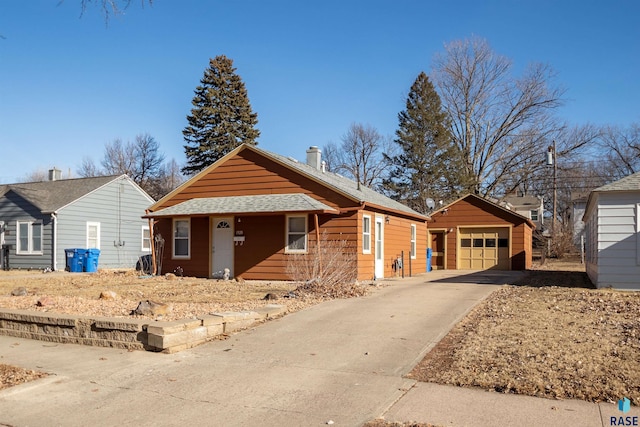 view of front of property with an outbuilding and a garage