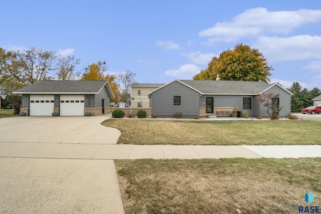 single story home featuring a garage and a front yard