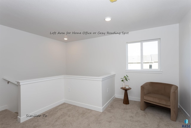 living area with light carpet