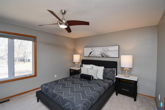 bedroom with ceiling fan and carpet flooring