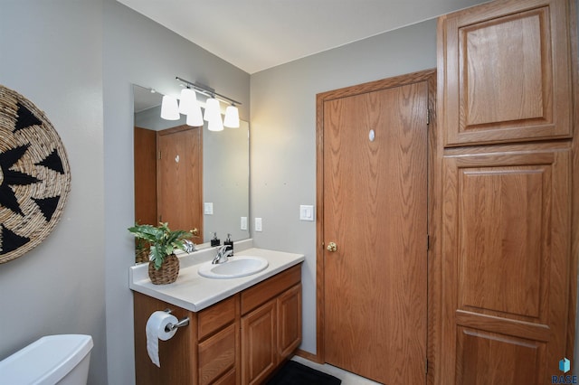 bathroom with vanity and toilet