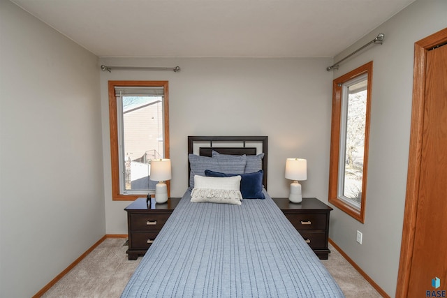 bedroom featuring light carpet