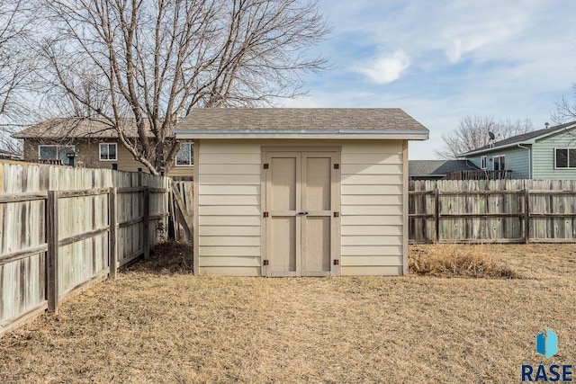 view of outbuilding featuring a lawn