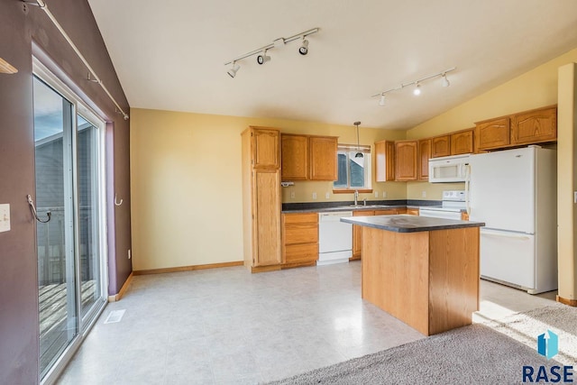 kitchen with vaulted ceiling, sink, hanging light fixtures, a center island, and white appliances