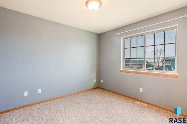 view of carpeted spare room