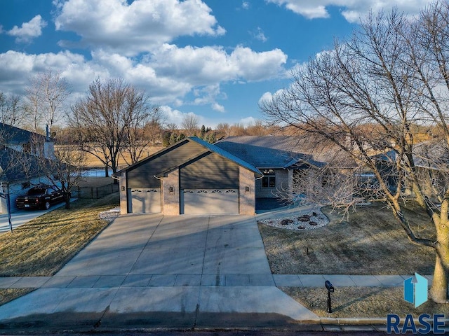 ranch-style home featuring a garage