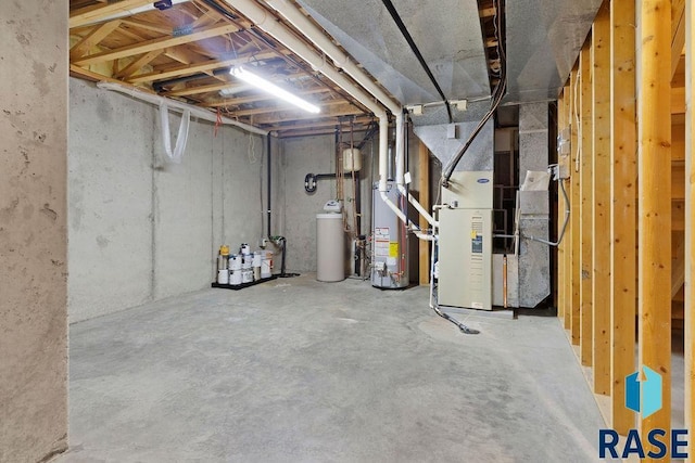 basement with water heater and heating unit