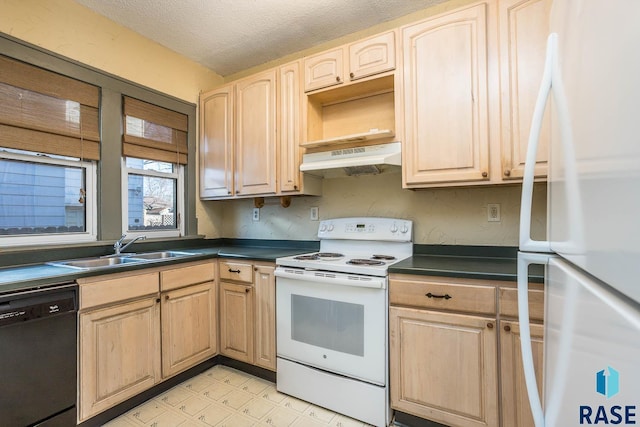 kitchen featuring sink, light brown cabinetry, a textured ceiling, and white appliances