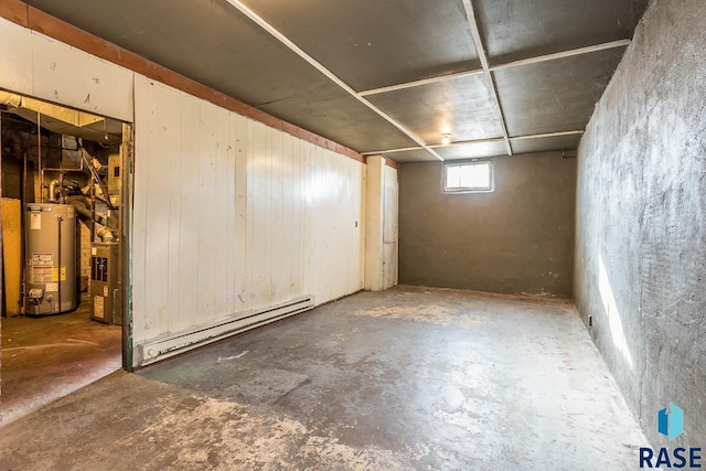 basement with a baseboard heating unit and gas water heater