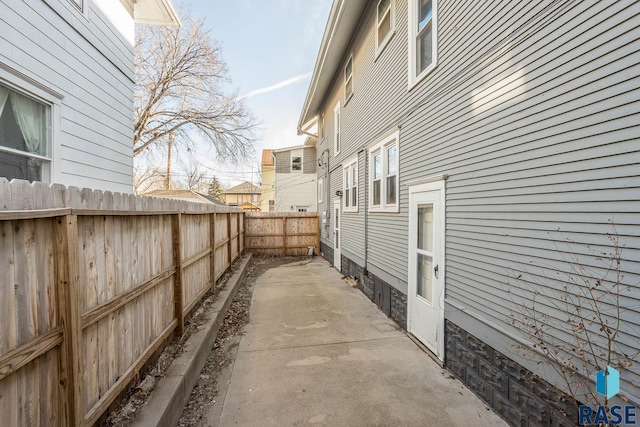 view of side of home with a patio