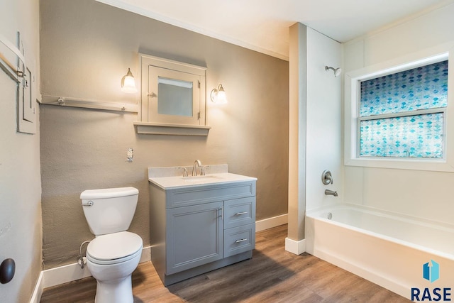 full bathroom featuring wood-type flooring, toilet, bathing tub / shower combination, and vanity