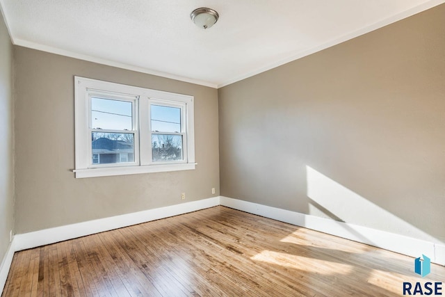 unfurnished room featuring crown molding and light hardwood / wood-style flooring