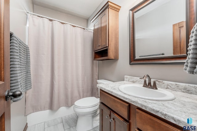 full bathroom featuring vanity, toilet, and shower / tub combo with curtain