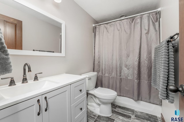 full bathroom with vanity, toilet, and shower / bath combo with shower curtain