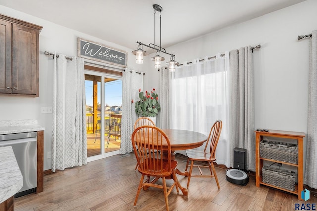 dining room with light hardwood / wood-style floors