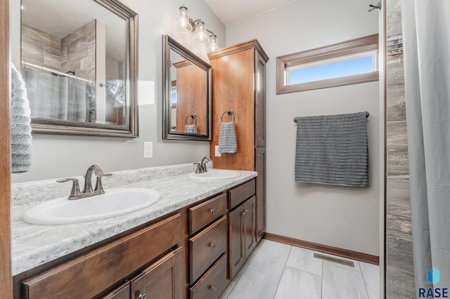 bathroom with tile patterned flooring, vanity, and a shower with shower curtain