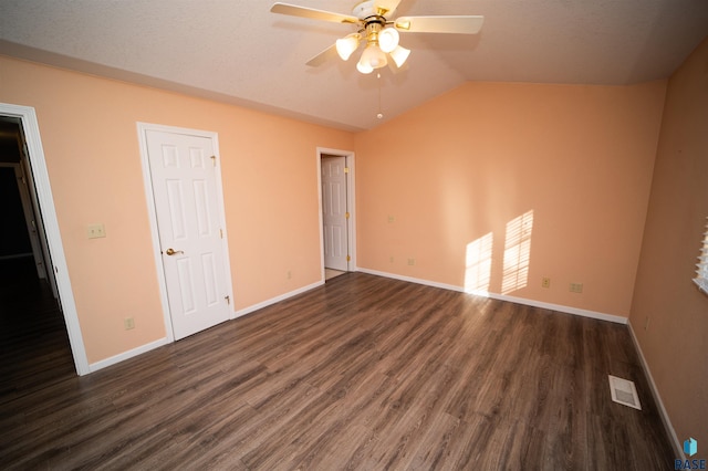 unfurnished bedroom with dark wood-type flooring, ceiling fan, and lofted ceiling