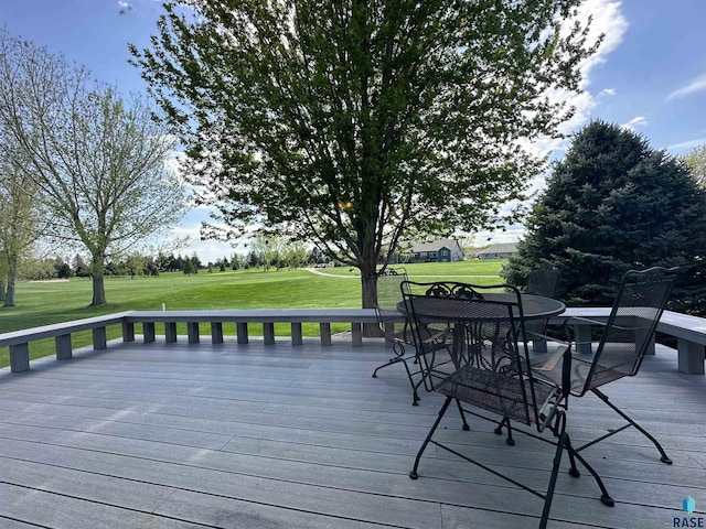 wooden terrace with a yard