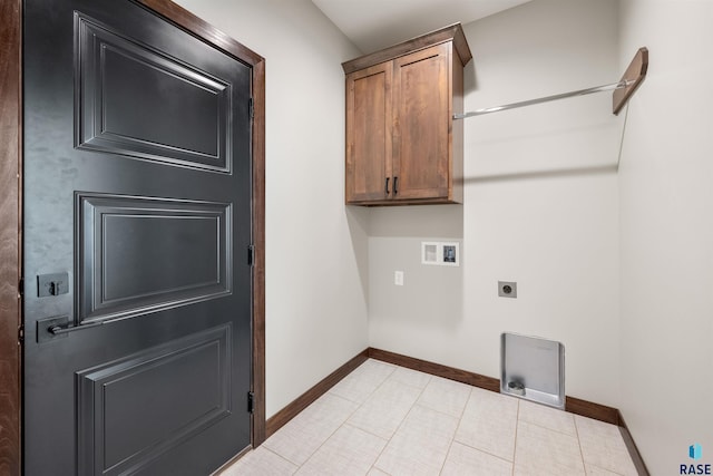 clothes washing area featuring cabinets, hookup for an electric dryer, hookup for a washing machine, and light tile patterned floors