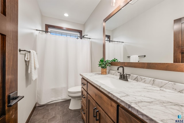 bathroom with walk in shower, tile patterned floors, vanity, and toilet