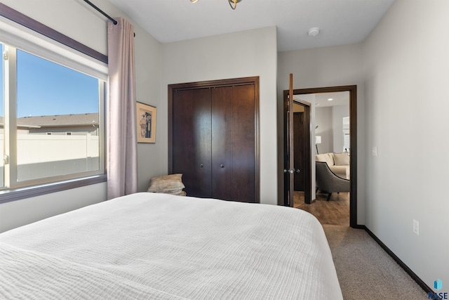 carpeted bedroom featuring a closet