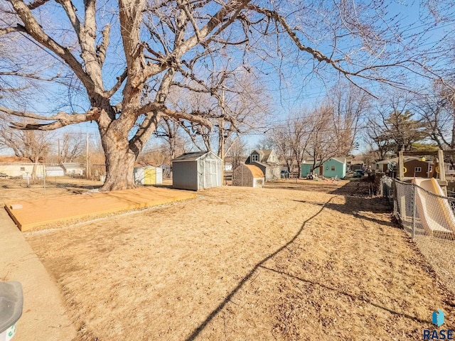 view of yard with a storage unit