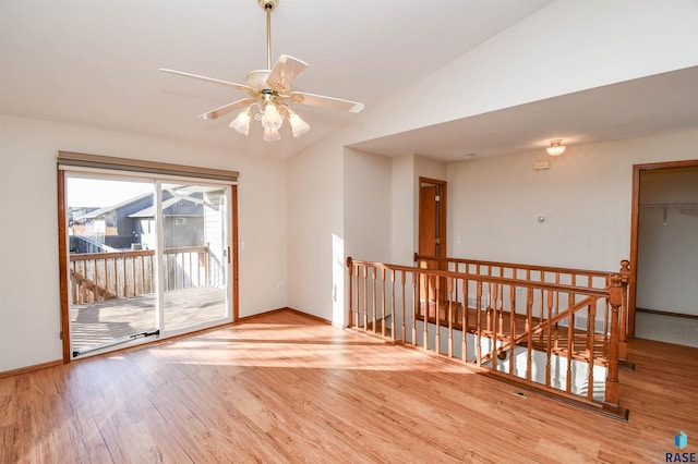 unfurnished room featuring vaulted ceiling, ceiling fan, and light hardwood / wood-style floors