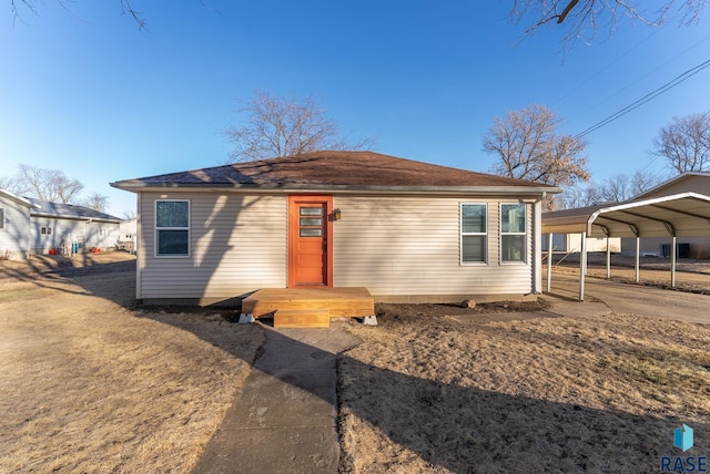 view of front of property featuring a carport