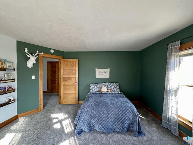 carpeted bedroom with a textured ceiling