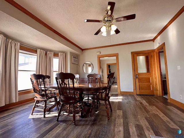 dining area featuring dark wood-type flooring, a wall mounted air conditioner, crown molding, and a textured ceiling