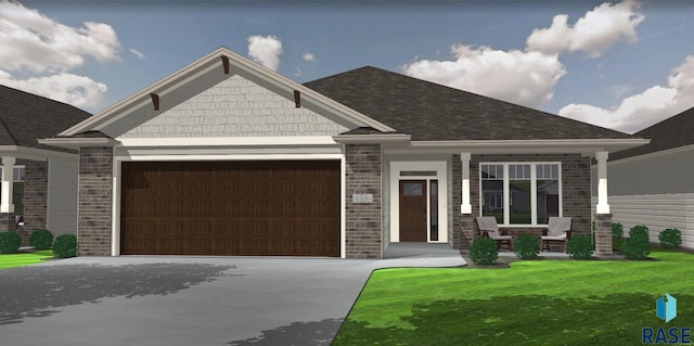 craftsman house featuring brick siding, a front yard, roof with shingles, a garage, and driveway