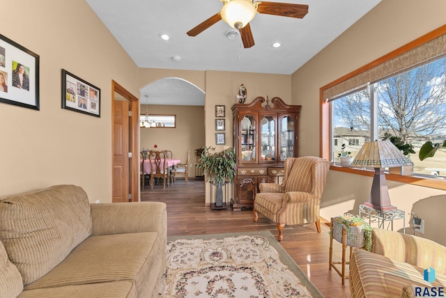 living room featuring hardwood / wood-style flooring and ceiling fan