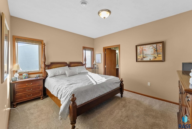 bedroom featuring light carpet