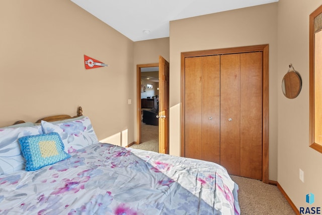 carpeted bedroom featuring a closet