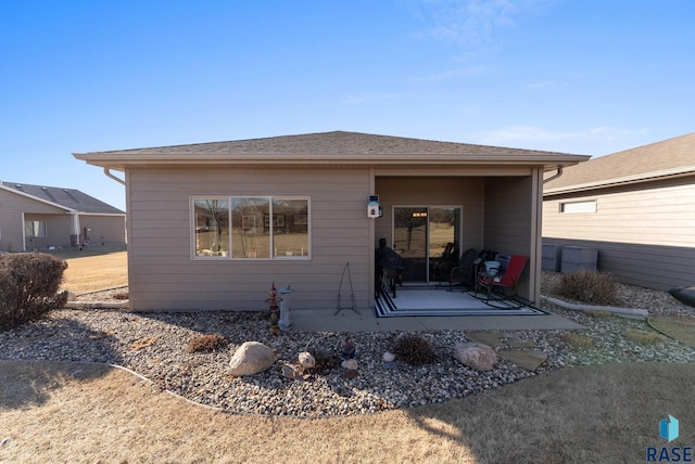 rear view of property featuring a patio