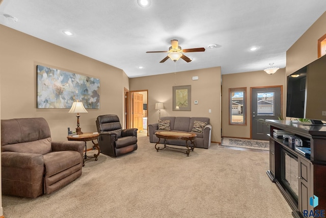 living room with light carpet and ceiling fan