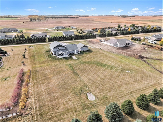 birds eye view of property with a rural view