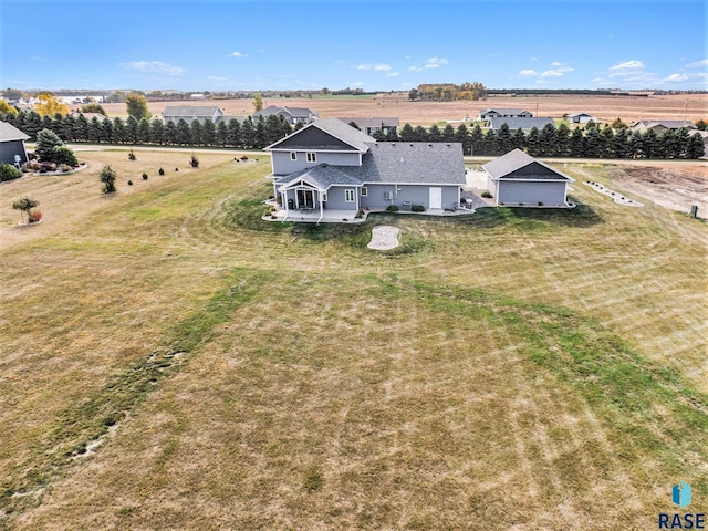 birds eye view of property featuring a rural view