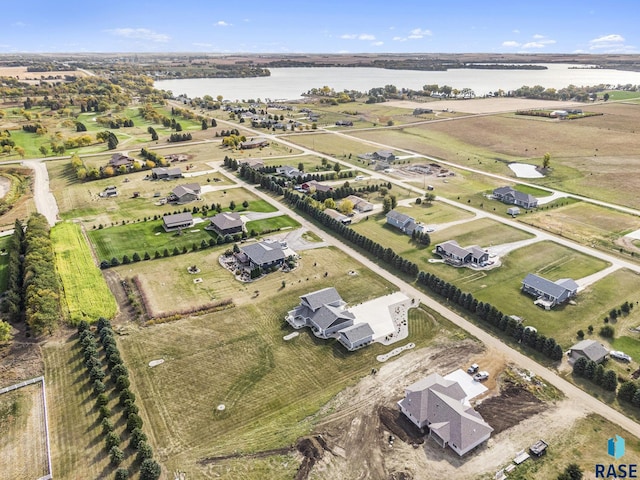 aerial view with a rural view and a water view