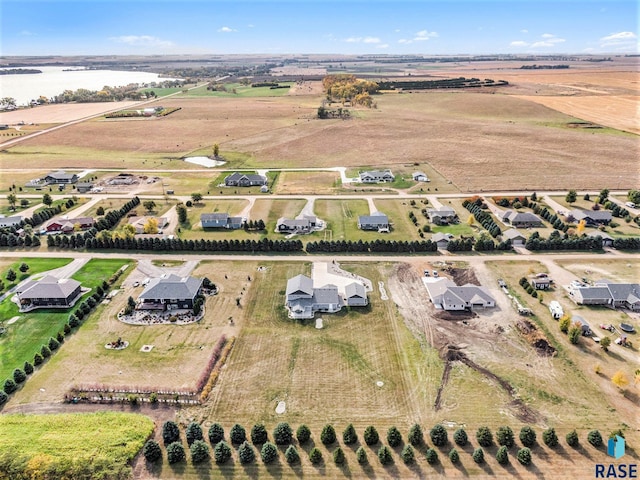 drone / aerial view featuring a water view and a rural view